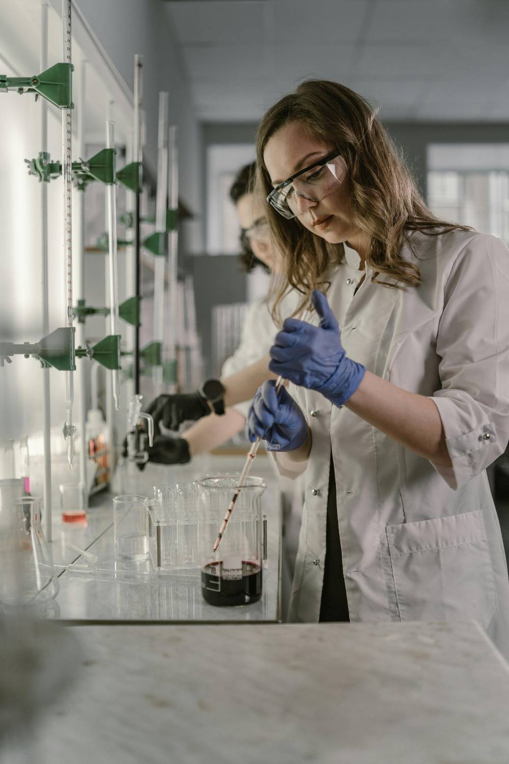 Researcher working with test tubes in a lab